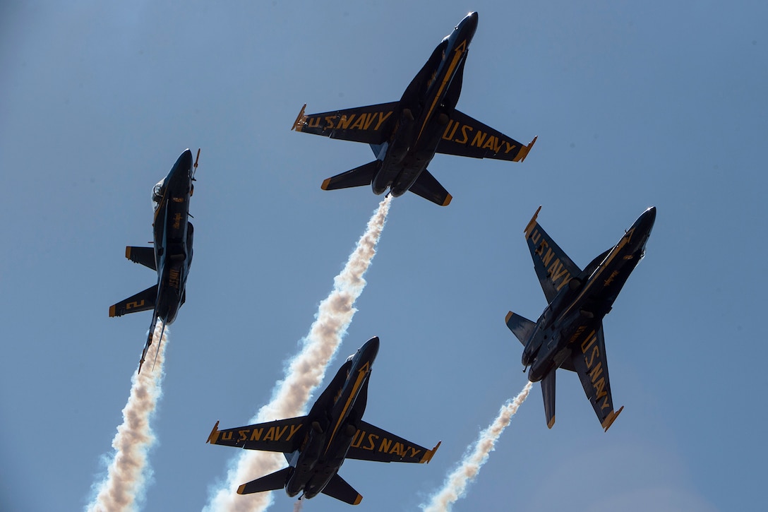 Navy planes fly in formation.