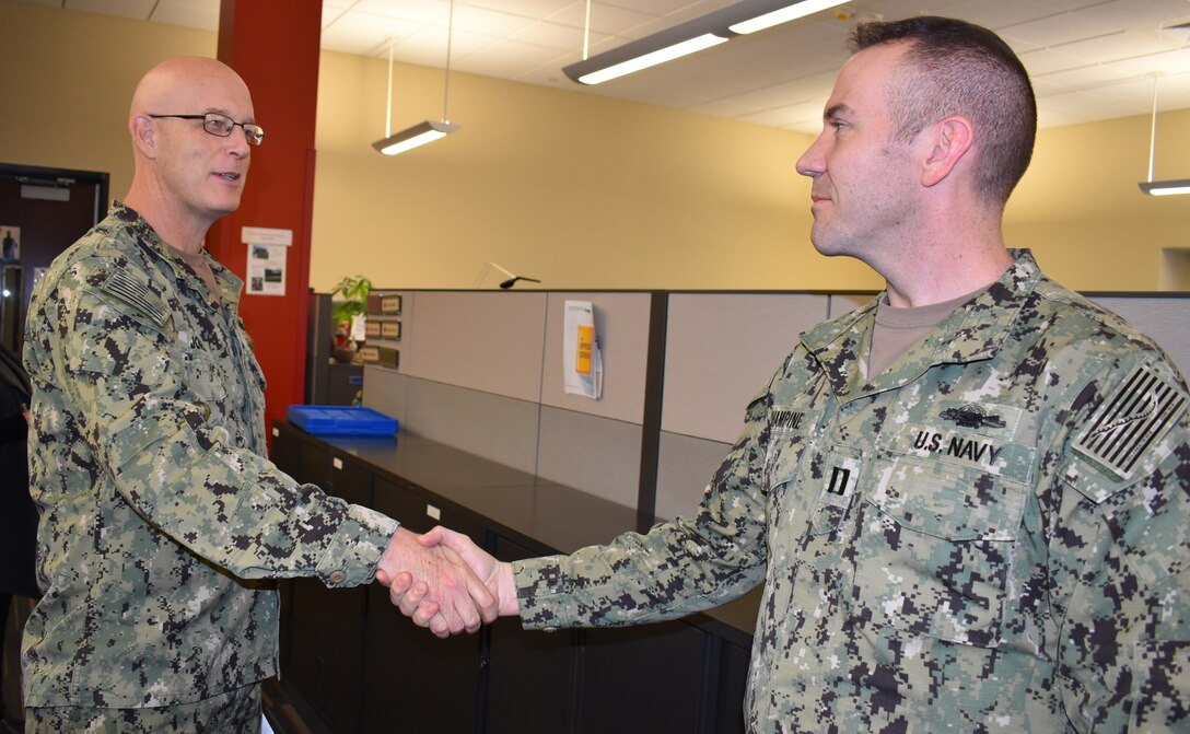 Distribution’s Champine receives commander’s coin