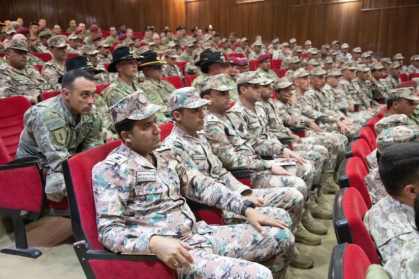 U.S. Army and Jordan Armed Forces soldiers listen to a guest speaker during a graduation ceremony for the JAF 10th Border Guard Force Battalion at the Peace Operations Training Center near Amman, Jordan, March 14, 2019. The 10th BGF graduated from the Joint Operational Engagement Program where they trained with the California Army National Guard’s 1st Squadron, 18th Cavalry Regiment for ten weeks to enhance the BGF readiness to protect and secure Jordan’s borders.