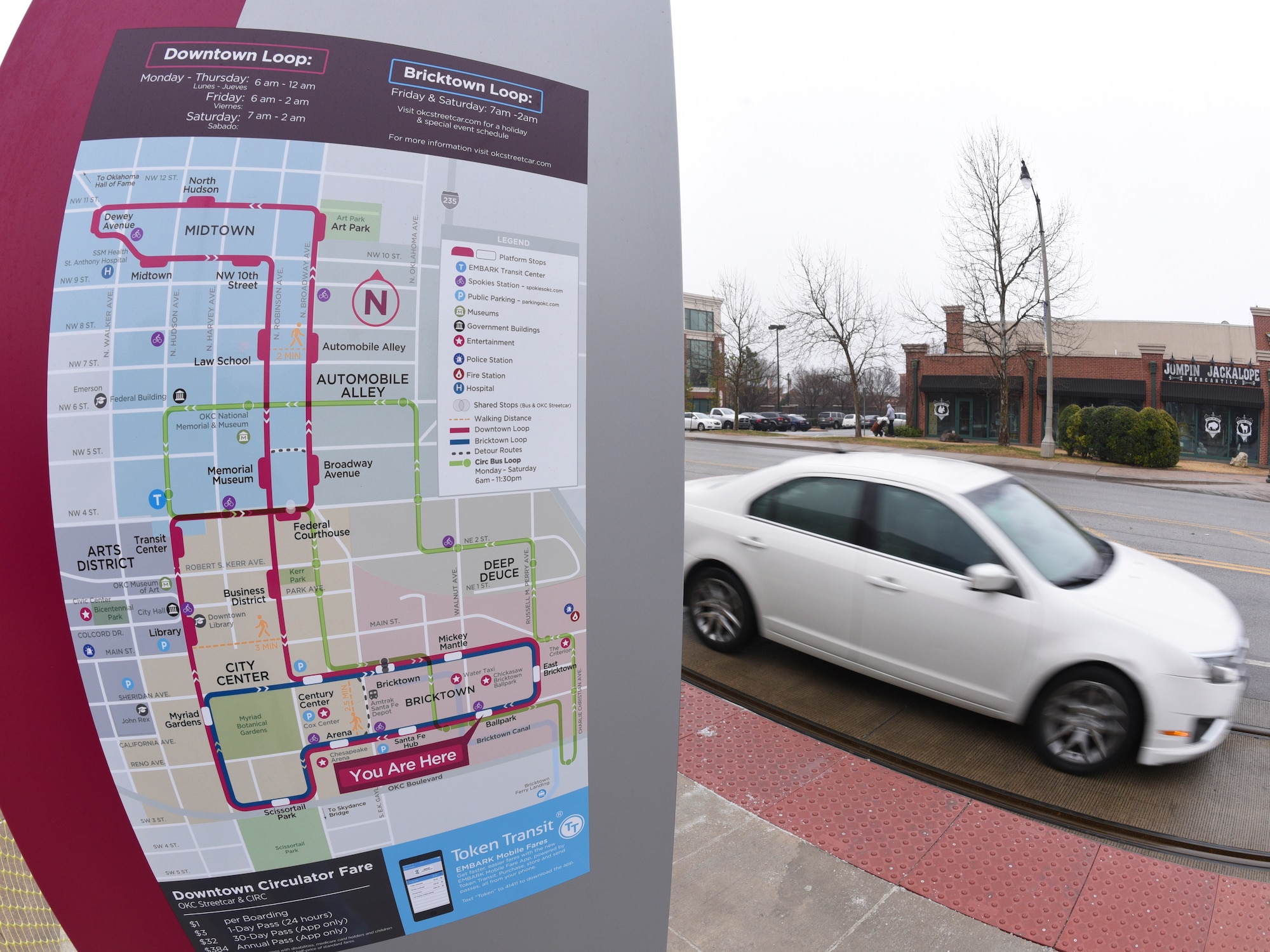 The Oklahoma City Streetcar map is displayed at a boarding platform near a busy street on March 8, 2019, Oklahoma City, Oklahoma.