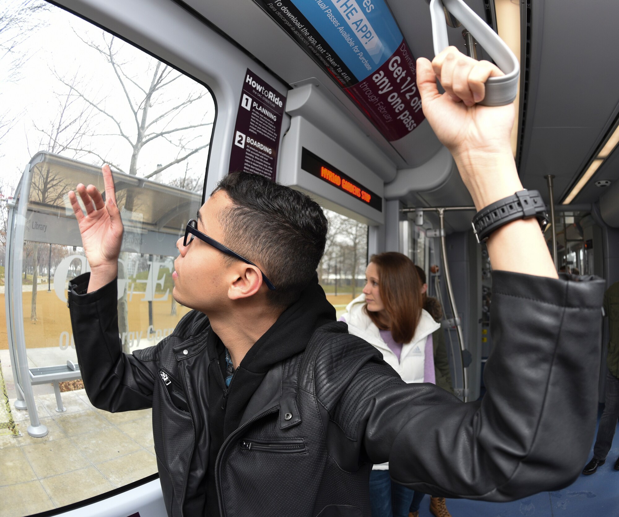 Airman 1st Class Willblas Coriano-Cotto, 552nd Operations Support Squadron intelligence analyst, points out the window of an Oklahoma City Streetcar as it passes a landmark during Tinker Air Force Base’s First Term Airmen Center tour of the downtown area on March 8, 2019, Oklahoma City, Oklahoma.