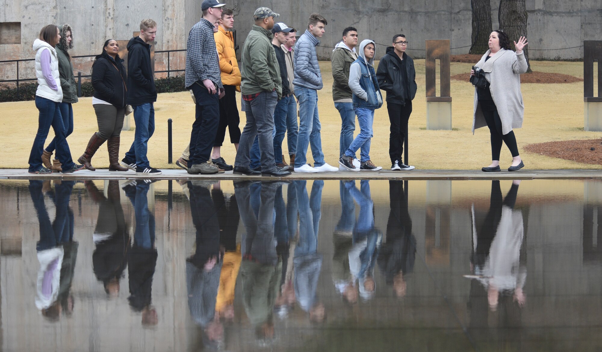 Cristy Ksepka, certified tourism ambassador for the Oklahoma City Convention and Visitors Bureau, right, tells the story of the Alfred P. Murrah Federal Building bombing to a group of Airmen from Tinker Air Force Base while on a tour of the downtown landmarks on March 8, 2019, Oklahoma City, Oklahoma.