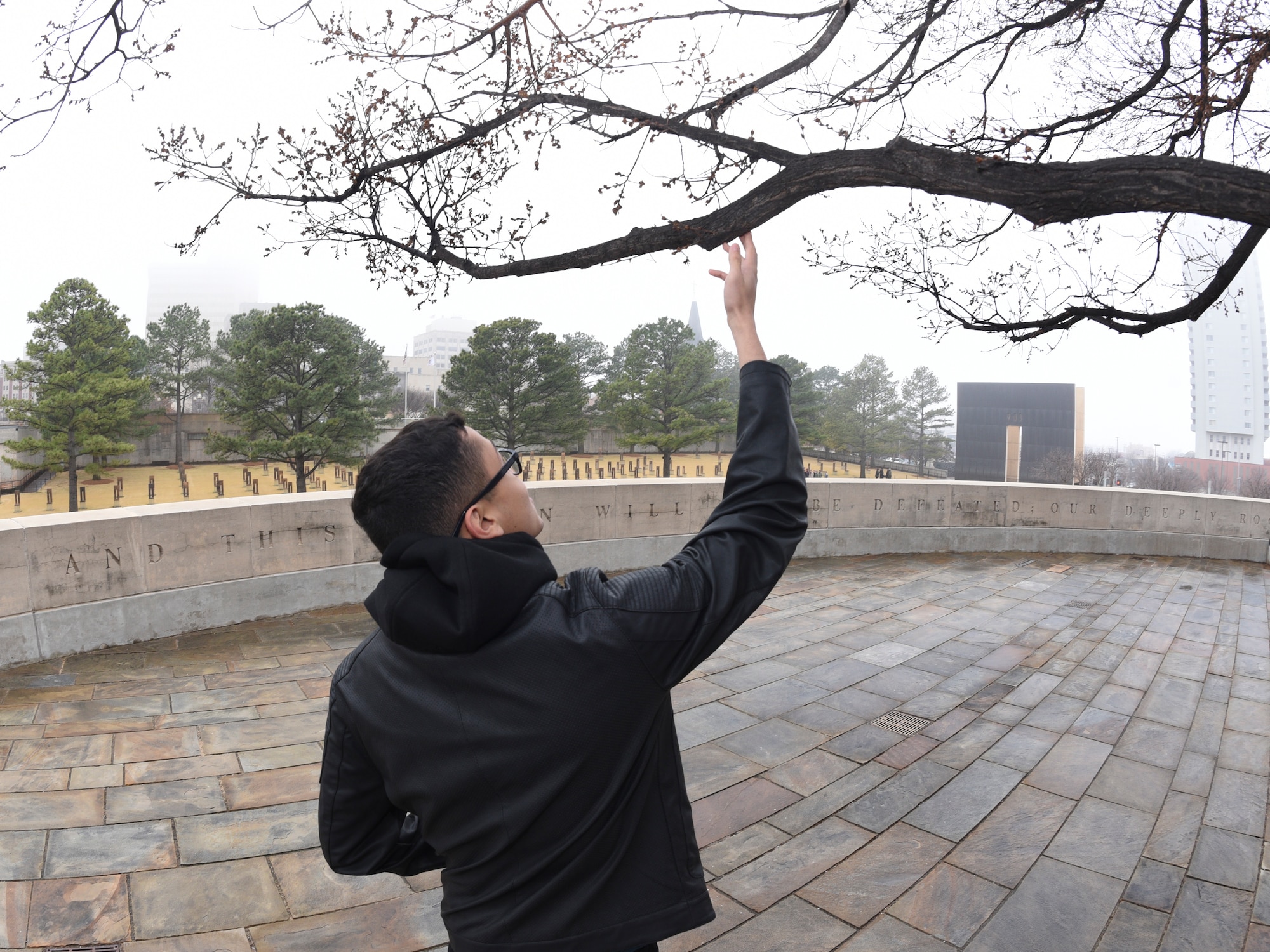 Airman 1st Class Willblas Coriano-Cotto, 552nd Operations Support Squadron intelligence analyst, looks at the giant ‘survivor tree’ at the Oklahoma City National Memorial Museum, site of the Alfred P. Murrah Federal Building bombing while attending Tinker Air Force Base’s First Term Airmen Center downtown tour on March 8, 2019, Oklahoma City, Oklahoma.