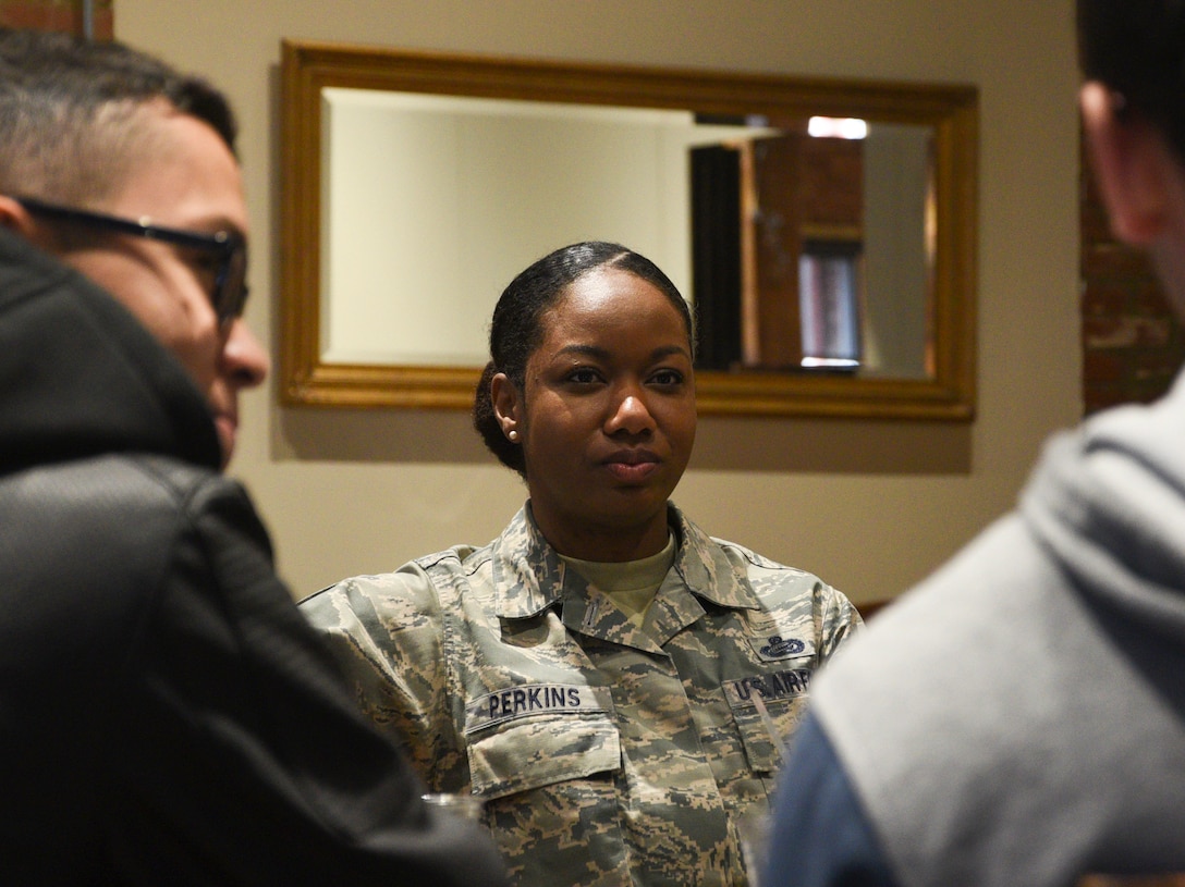 Chief Master Sgt. Shakeisha Perkins, 72nd Force Support Squadron superintendent, talks with Airmen in a relaxed setting at the Bricktown Brewery restaurant, during Tinker Air Force Base’s First Term Airmen Center downtown tour.