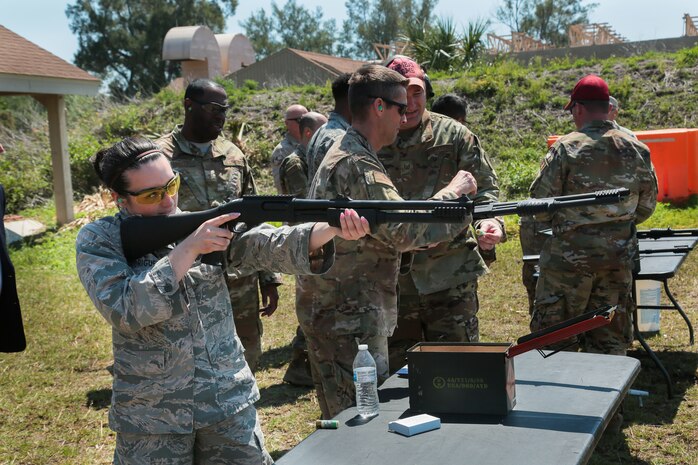 U.S. and coalition military personnel from U.S. Central Command, U.S. Special Operations Command and MacDill Air Force Base fire non-lethal weapons during a familiarization fire at MacDill AFB, March 21, 2019.