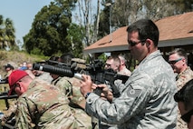 U.S. and coalition military personnel from U.S. Central Command, U.S. Special Operations Command and MacDill Air Force Base fire non-lethal weapons during a familiarization fire at MacDill AFB, March 21, 2019.