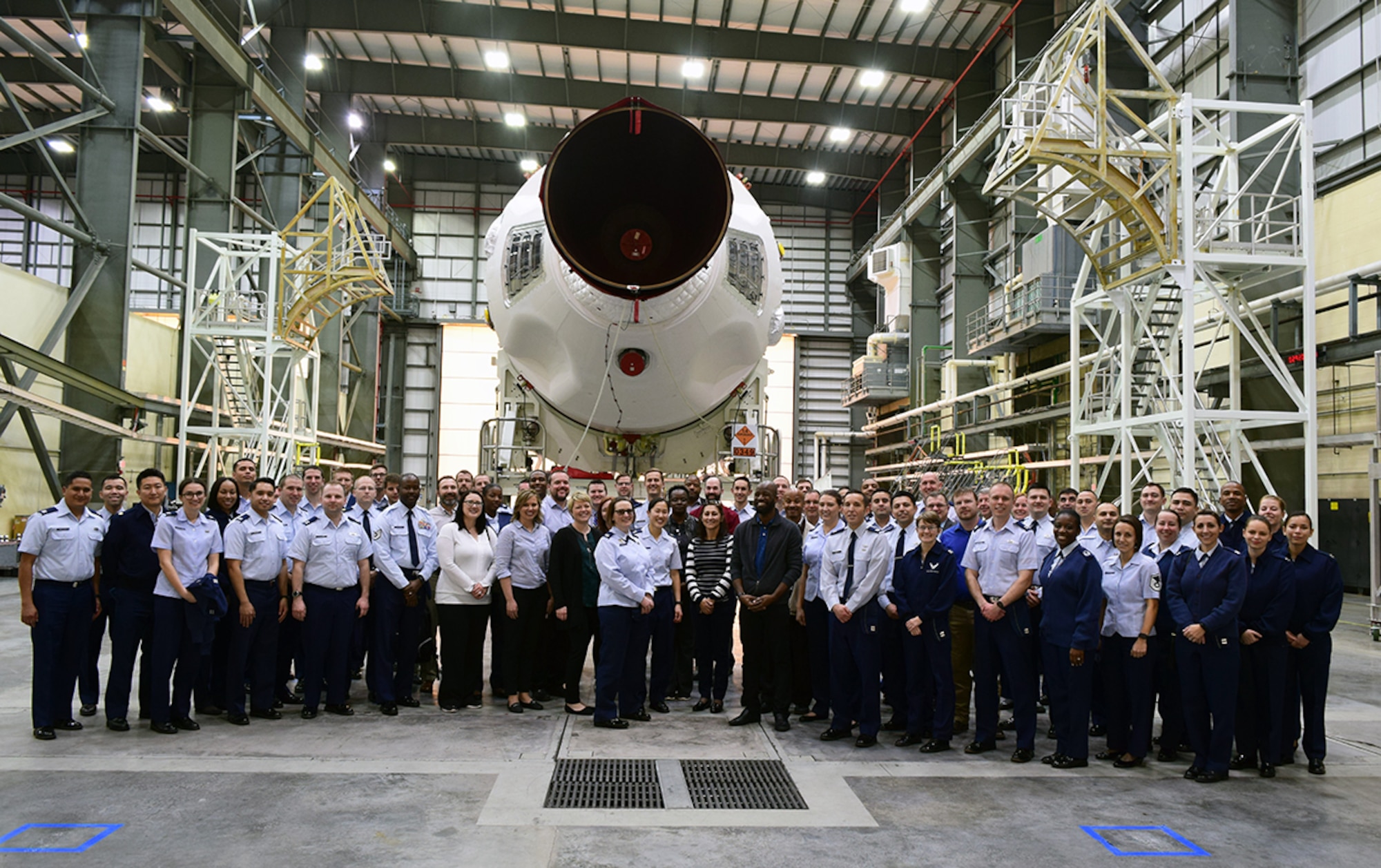 EWI Fellows posed in front of a Delta IV Medium Booster - GPS III Mission.  During the EWI Mid Tour Review, Fellows toured both the United Launch Alliance and Lockheed Martin Missiles & Fire Control facilities.  Senior leadership from both companies took the time to provide their perspective on partnering with industry and shared what’s made them successful. (U.S. Air Force Photo by Capt Frank Larkins)