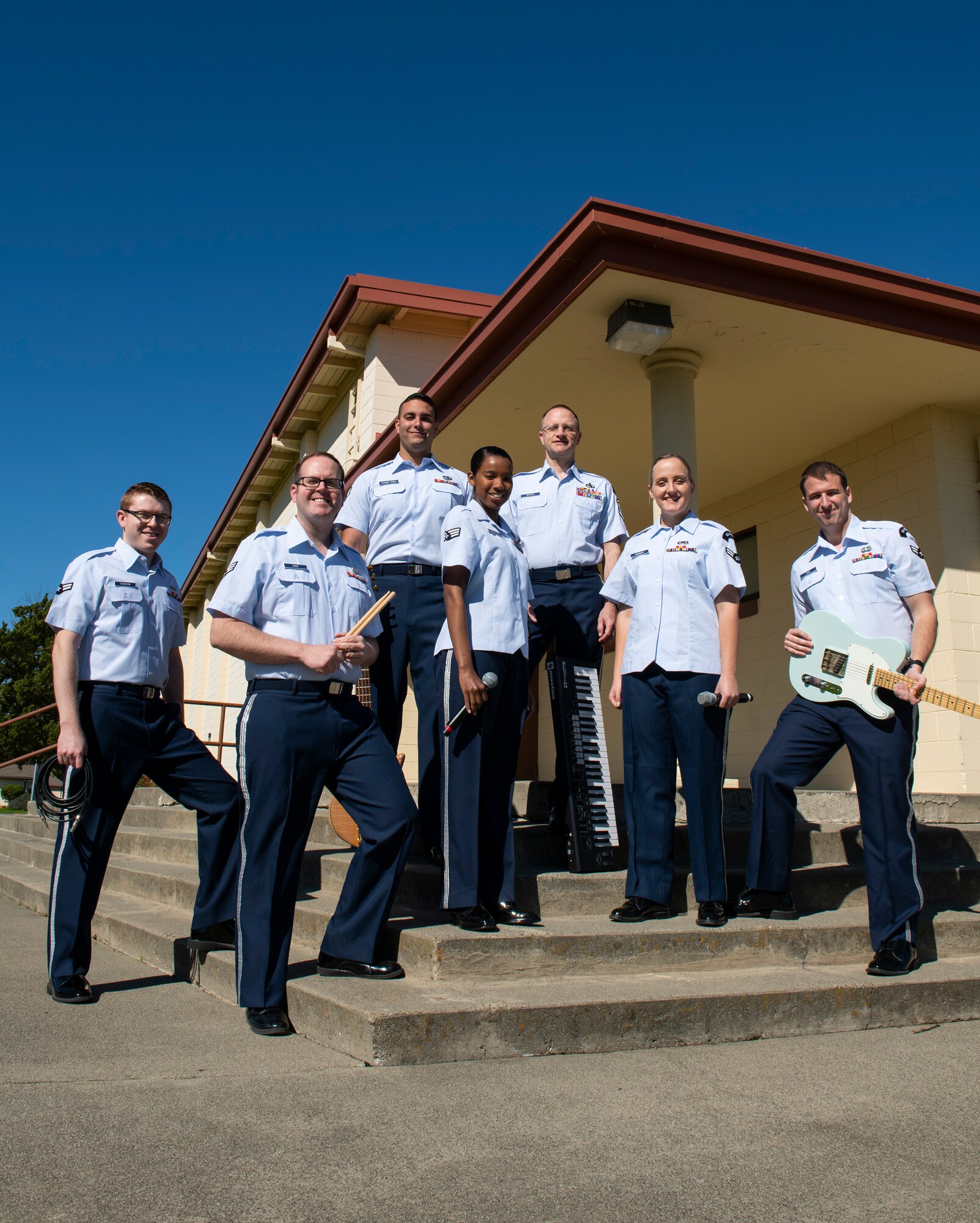 Airmen with the Band of the Golden West pose for a group photo at Travis Air Force Base, Mar. 11, 2019. (U.S. Air Force photo by Lan Kim)