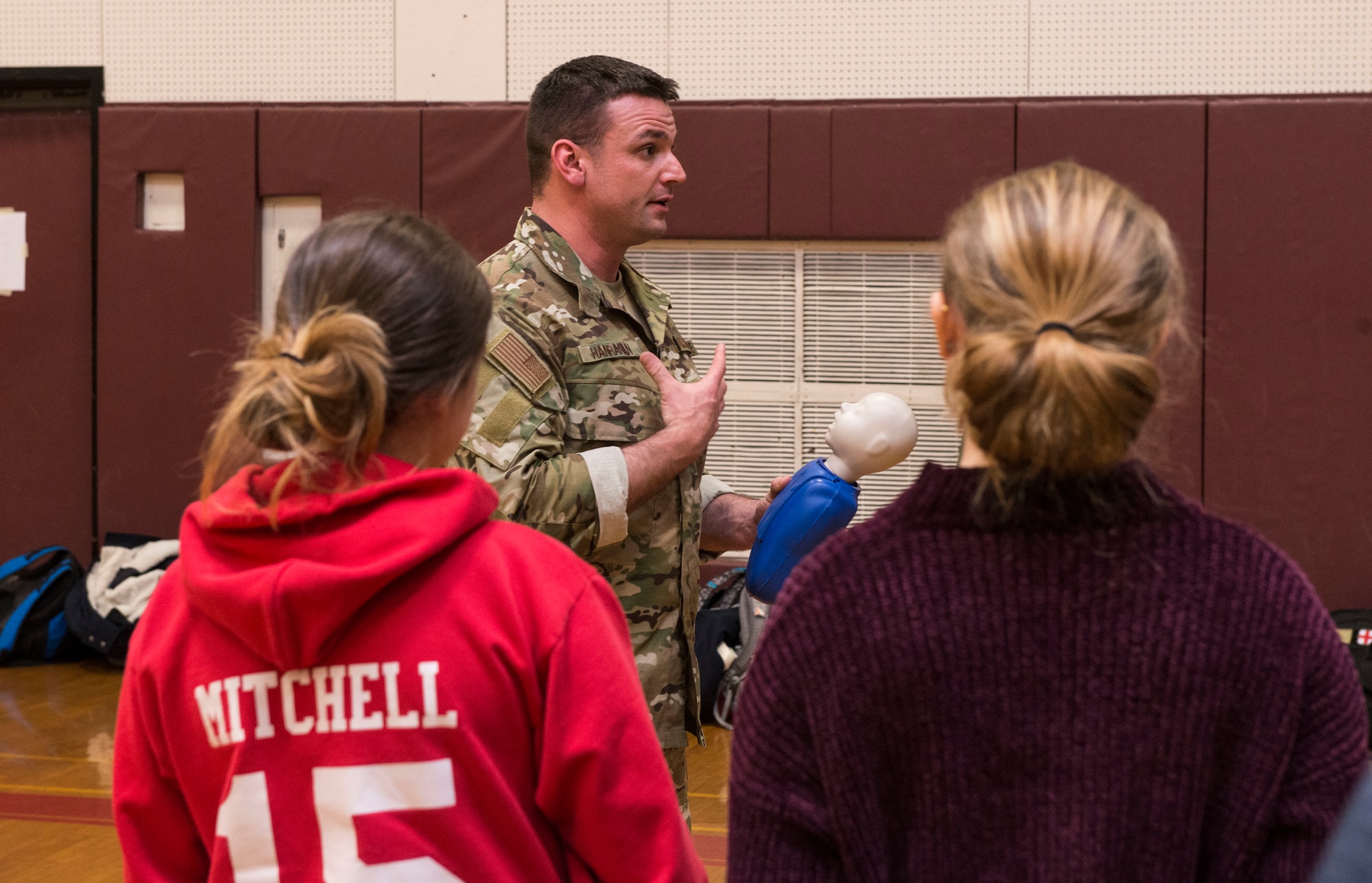 Master Sgt. Darrel Hanrahan, an Aerospace Medical Technician assigned to the 103rd Medical Group, helps teach a CPR class at Torrington High School,  Torrington, Conn., March 22. Airmen from the 103rd Medical Group volunteered to help students meet requirements for their physical education class. (U.S. Air National Guard photo by Staff Sgt. Steven Tucker)