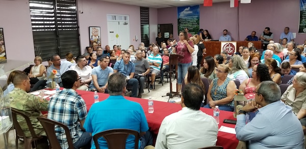 Photo of crowd addressing USACE personnel in Ciales, PR.