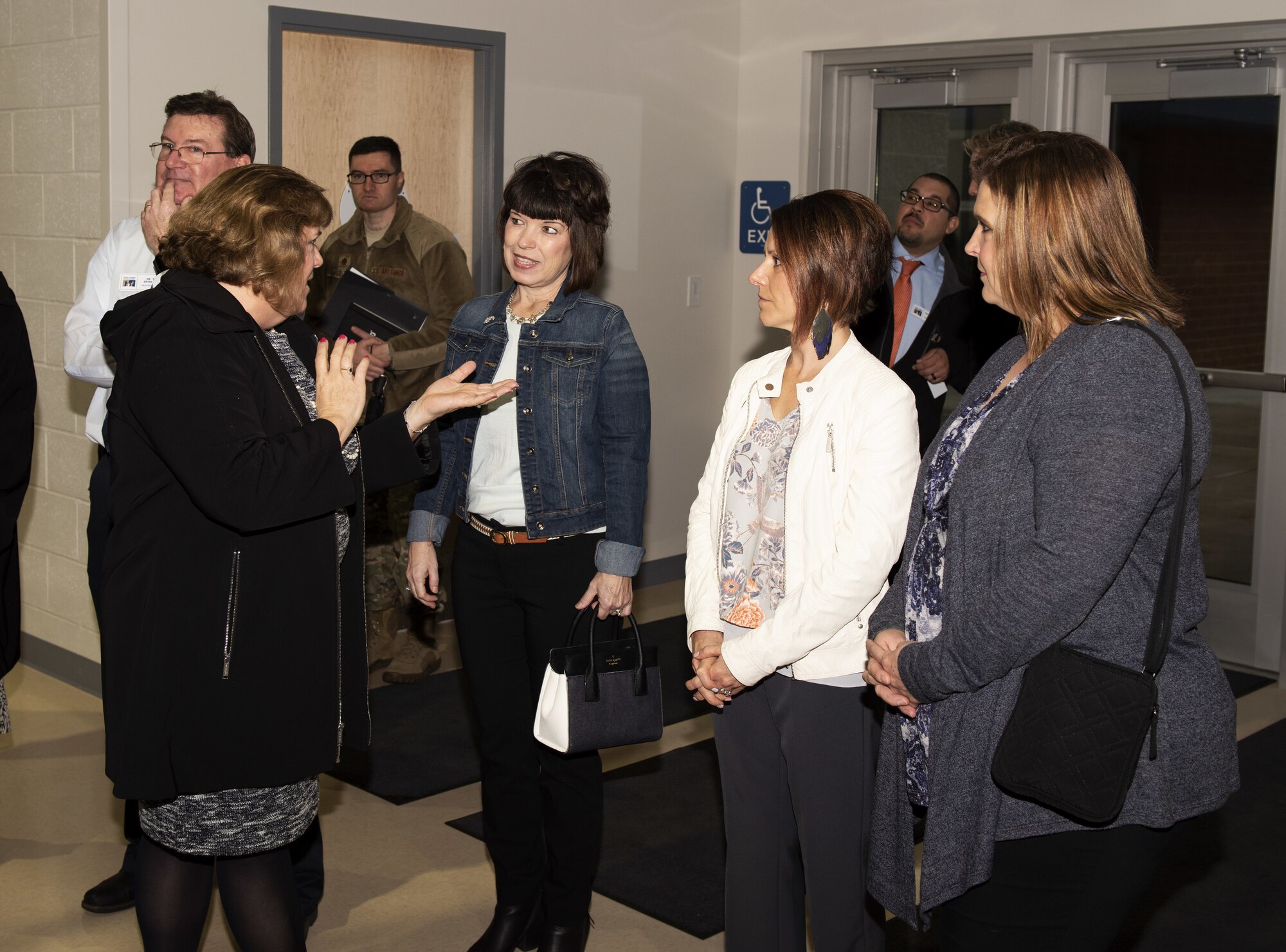 Pam Conklin, Travis Unified School District superintendent, converses with Mrs. Kelly Barrett, spouse of the 18th Air Force commander, Maj. Gen. Sam Barrett; Courtney Nelson, spouse of 60th Air Mobility Wing commander, Col. Jeff Nelson and Tia Crowder, spouse of 60th Air Mobility Wing command chief, Chief Master Sgt. Derek Crowder, at Scandia Elementary School, Fairfield, California, March 6, 2019. Barrett visited the school to discuss the military-friendly enrollment policies that Travis Unified School District has instituted to accommodate as many military families as possible in a district with an increasing civilian population.
