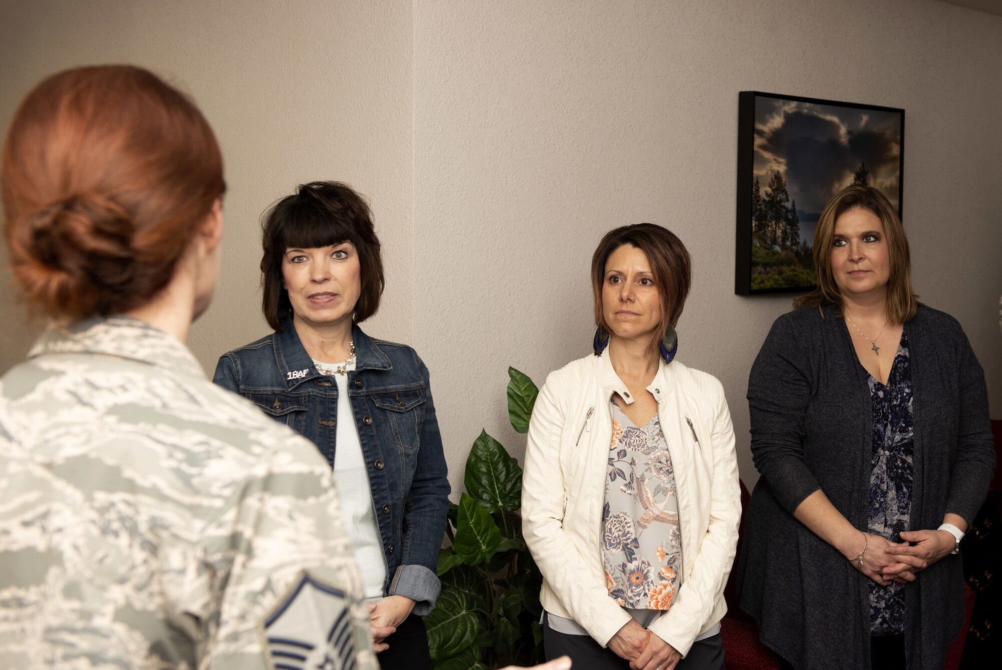 U.S. Air Force Master Sgt. Erine Gallant, Airman and Family Readiness Center superintendent, briefs Kelly Barrett, spouse of the 18th Air Force commander, Maj. Gen. Sam Barrett; Courtney Nelson, spouse of 60th Air Mobility Wing commander, Col. Jeff Nelson and Tia Crowder, spouse of 60th Air Mobility Wing command chief, Chief Master Sgt. Derek Crowder, March 6, 2019, at the Airman and Family Readiness Center, Travis Air Force Base, California. Barrett toured the facility as part of her focus on Air Force spouse programs.