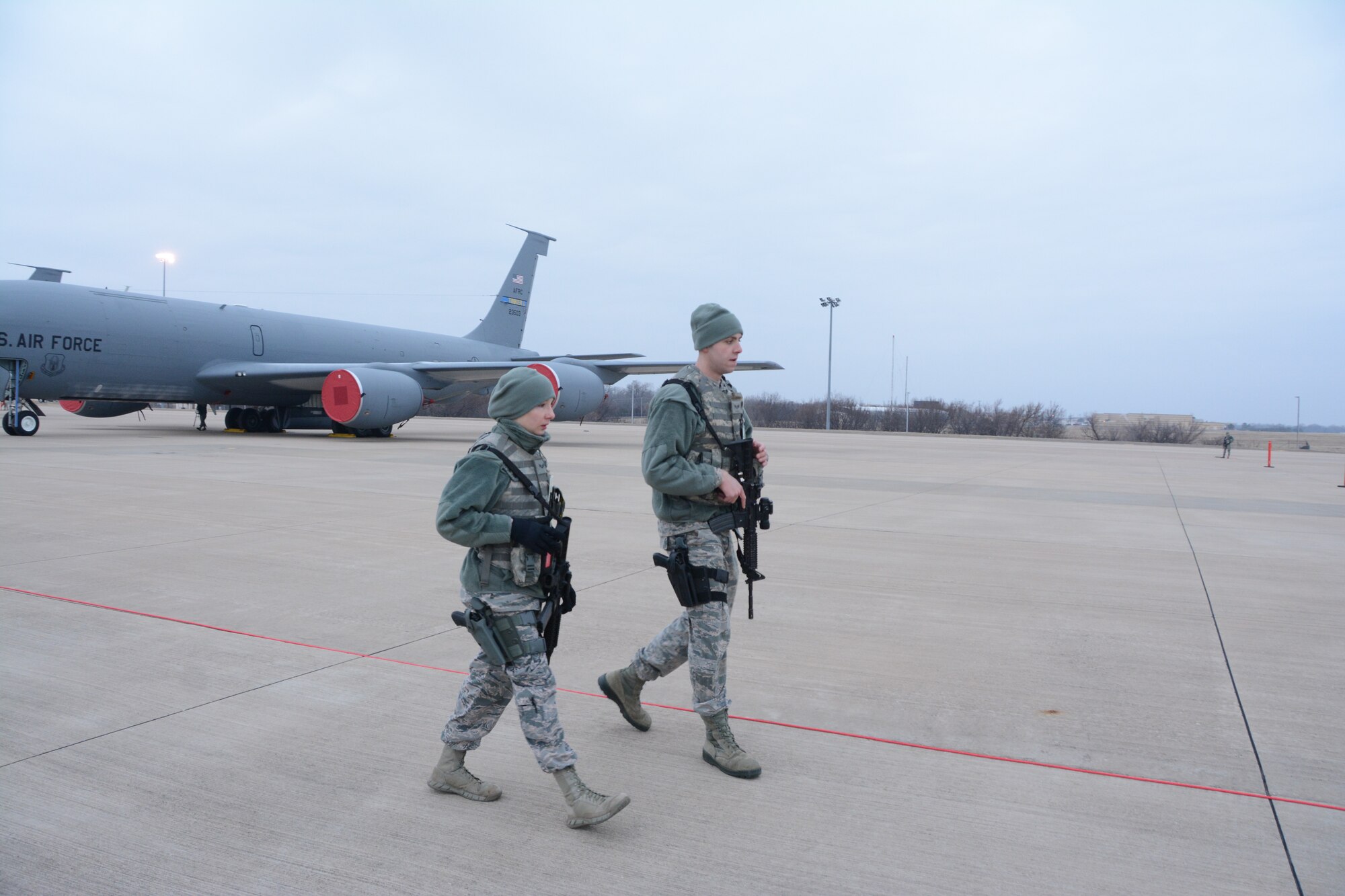 Senior Airmen Taylor Adamson and Austin Hiatt, 507th Security Forces Squadron, set up a secure perimeter during an exercise geared toward wartime preparation and readiness on the 507th Air Refueling Wing flightline March 2, 2019, at Tinker Air Force Base, Oklahoma. The 507th Air Refueling Wing's unit effectiveness inspection capstone event is scheduled for Nov. 15-19, 2019. (U.S. Air Force photo by Tech. Sgt. Lauren Gleason)