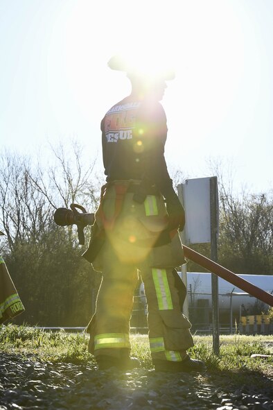 Brian P. Whitener, lead firefighter with the 2nd Civil Engineering Squadron, prepares the fire hose before a live fire training exercise March 21, 2019, at Barksdale Air Force Base, Louisiana. Whitener has prior service in the Air Force as a firefighter and now works with the 2nd CES as a civilian. (U.S. Air Force Photo by Airman Jacob B. Wrightsman)