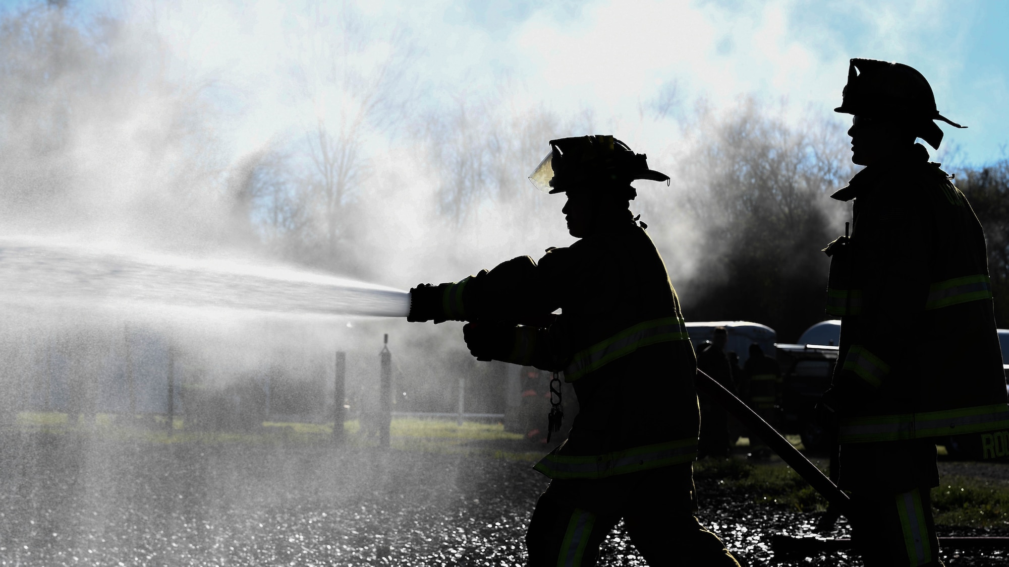 U.S. Air Force Master Sgt. Glenn Rodgers, assistant chief of operations with the 2nd Civil Engineering Squadron, supervises Brian P. Whitener, lead firefighter with the 2nd CES, as he sprays down the front of a simulation aircraft March 21, 2019, at Barksdale Air Force Base, Louisiana. The live fire training allows firefighters to work on nozzle practices, hose line advancing and firefighting techniques. (U.S. Air Force photo by Airman Jacob B. Wrightsman)