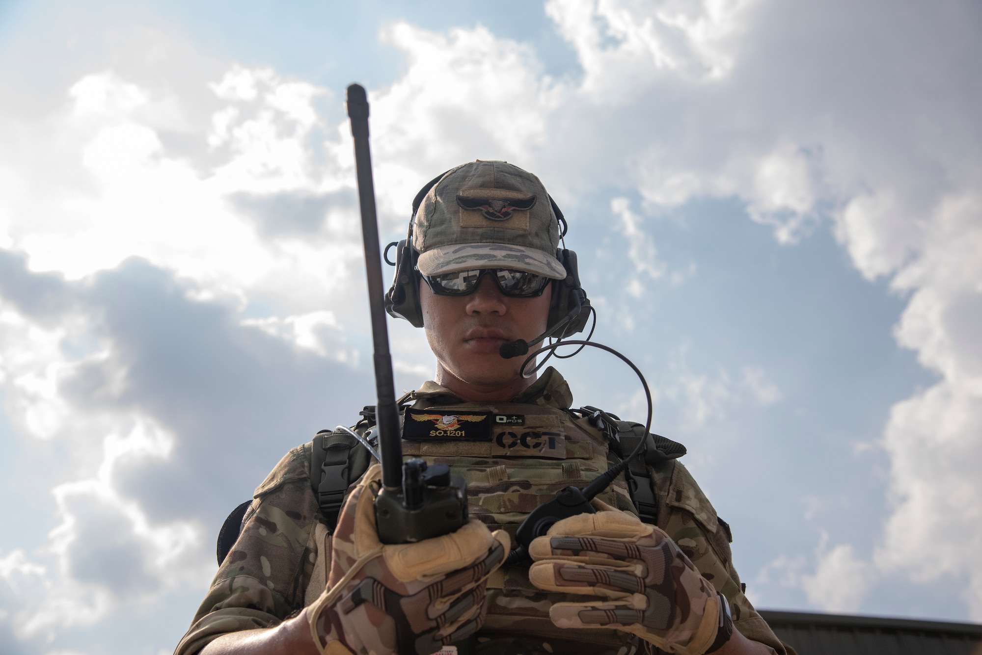 Royal Thai air force Flying Officer Jirot Prasoetampaisakul, 2nd Company 3rd Battalion Special Operations Combat Control Team member, performs a radio check prior to calling in a simulated close air support attack during COPE Tiger 2019 at Chandy Range, Thailand, March 15, 2019.