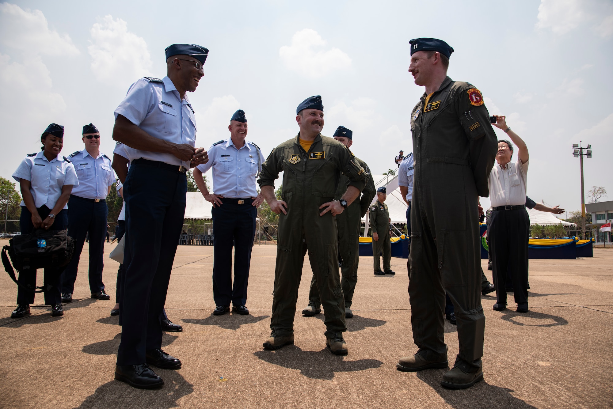 U.S. Air Force Gen. CQ Brown Jr., Pacific Air Forces commander, talks with Lt. Col. Matthew Kenkel, 14th Fighter Squadron commander, and Capt. Joe Boyle, 14th Fighter Squadron COPE Tiger 2019 project officer, following the closing ceremony for COPE Tiger 2019 at Korat Royal Thai Air Force Base, Thailand, March 22, 2019.