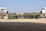 U.S. Navy Sailors pose for a group photo with Indian navy aircrews during a subject matter expert exchange.