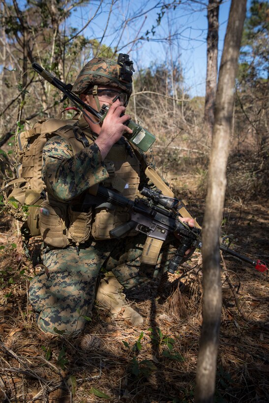 Sgt. Liam Lynch communicates during Tactical Recovery of Aircraft and Personnel training at Camp Lejeune, North Carolina, Feb. 1, 2019. TRAP training enhances combat readiness and crisis response skills by preparing Marines to confidently enter potentially combative areas, tactically extract personnel, recover aircraft, and retrieve or destroy sensitive material. Lynch is an Infantry Marine with 1st Battalion, 8th Marines. (U.S. Marine Corps photo by Lance Cpl. Larisa Chavez)