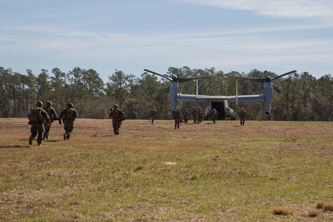 Marines board an MV-22 Osprey during Tactical Recovery of Aircraft and Personnel training at Camp Lejeune, North Carolina, Feb. 1, 2019. TRAP training enhances combat readiness and crisis response skills by preparing Marines to confidently enter potentially combative areas, tactically extract personnel, and recover aircraft, retrieve or destroy sensitive material. The Marines are with 1st Battalion, 8th Marines. (U.S. Marine Corps photo by Lance Cpl. Larisa Chavez)