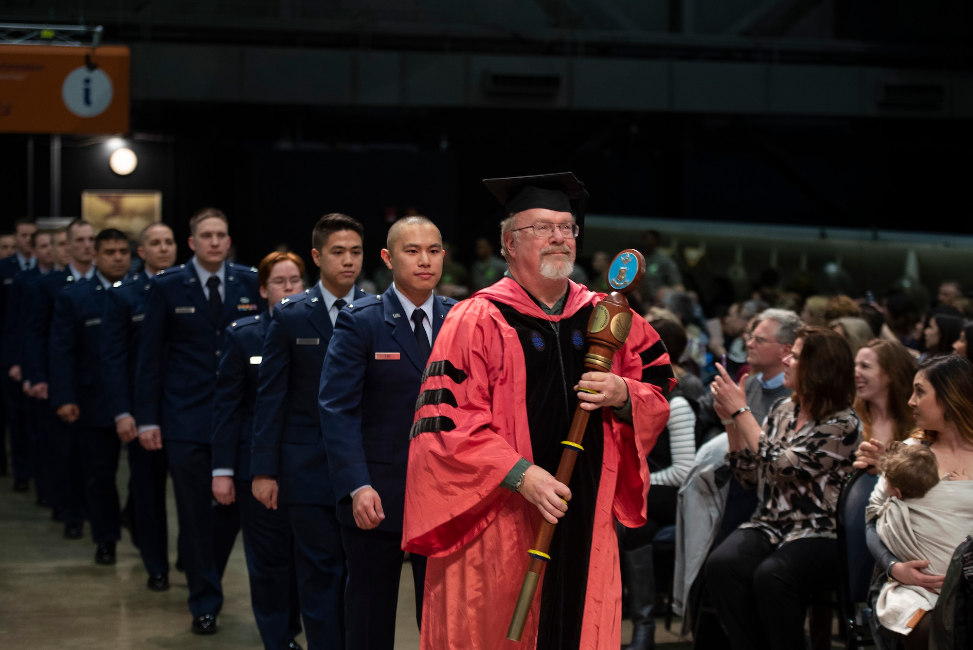 Dr. William Wiesel, grand marshal, leads 2nd Lt. Kevin Lin, the other graduates and faculty into the Air Force Institute of Technology commencement ceremony March 21, 2019, at the National Museum of the U.S. Air Force, Wright-Patterson Air Force Base, Ohio. More than 200 advanced degrees were awarded to officers, enlisted and civilians from the U.S., Australian and Brazilian armed forces. (U.S. Air Force photo by R.J. Oriez)