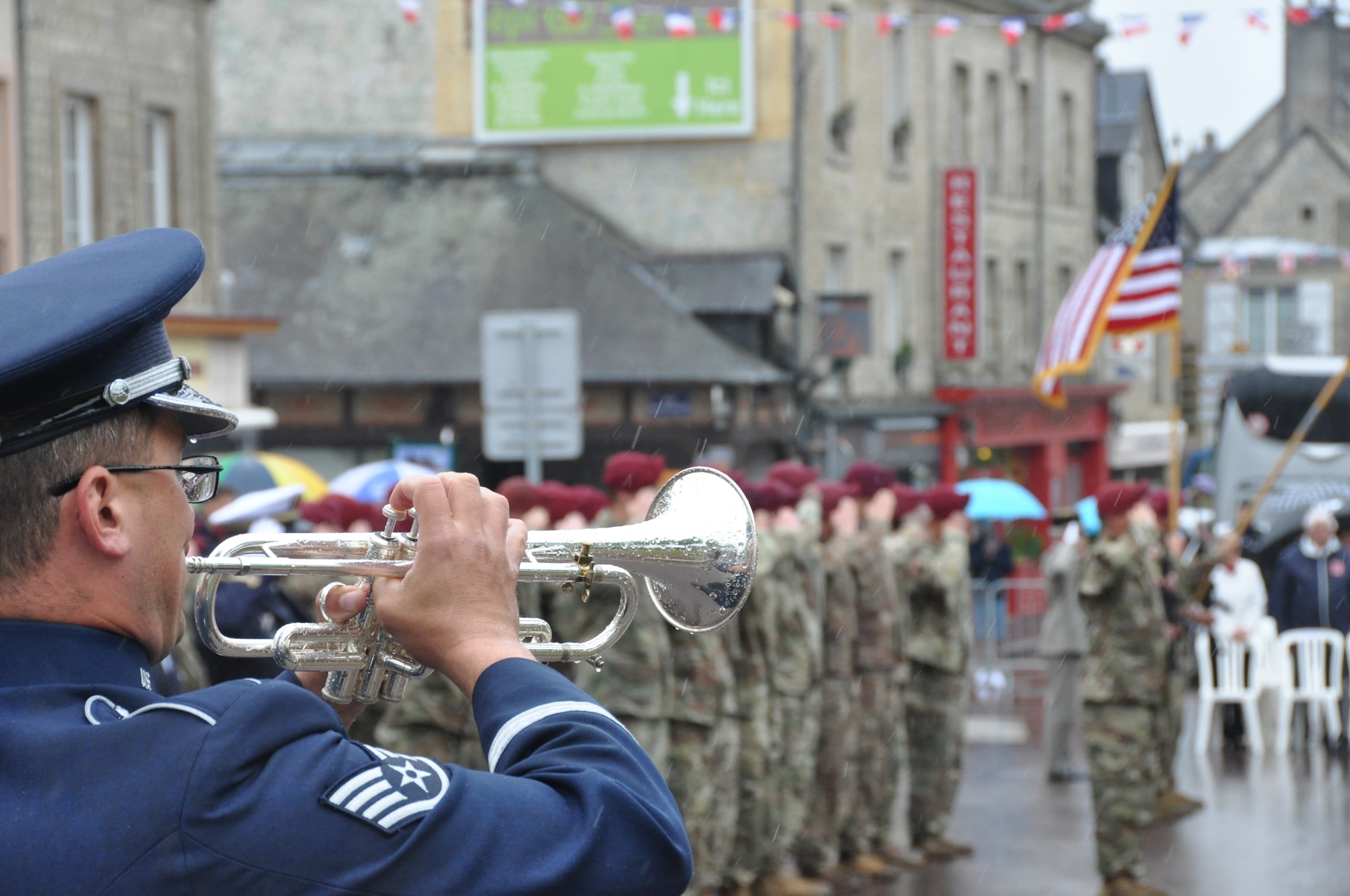 Air Force trumpet player performing in street at international ceremony