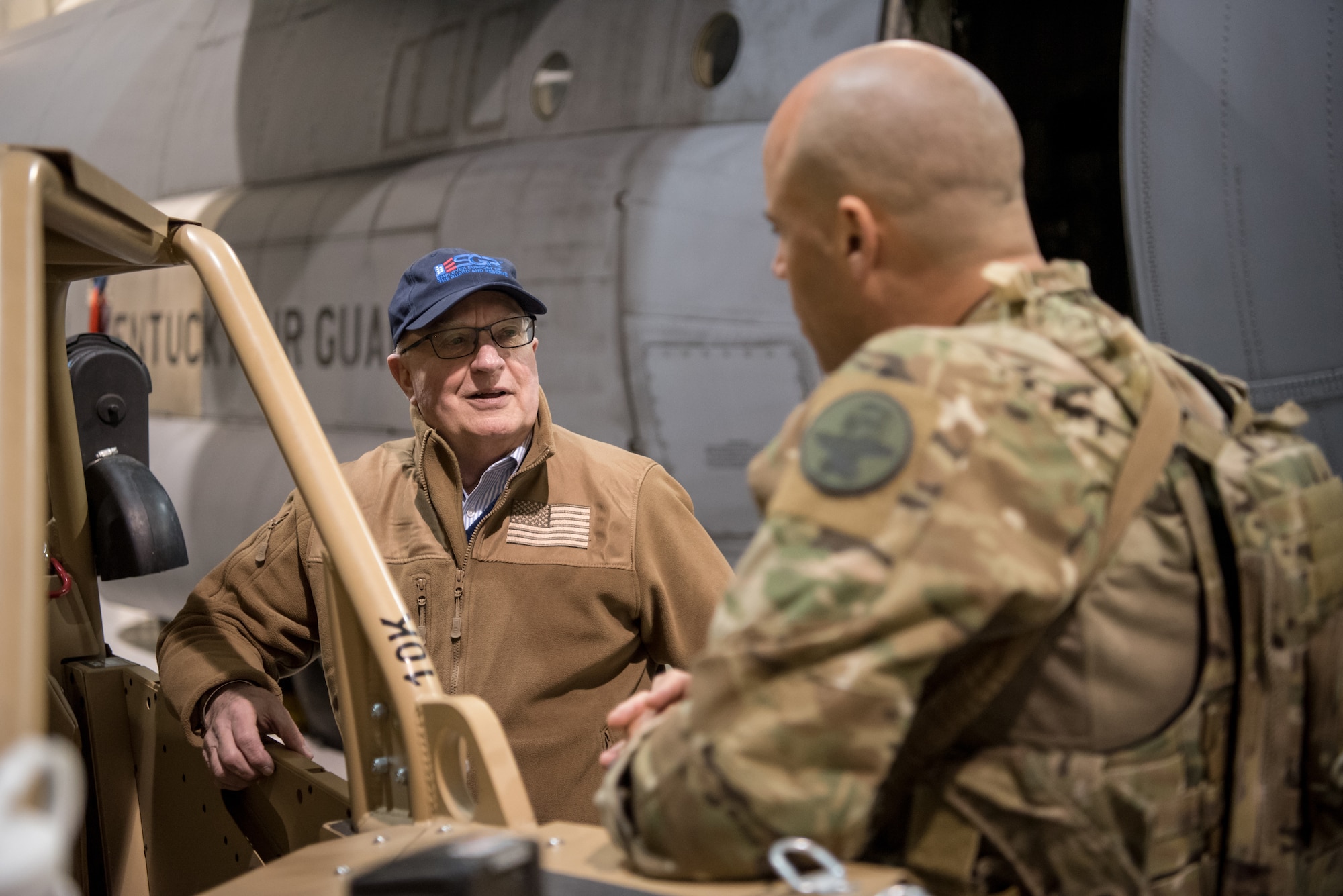 Philip Miller (left), state chairman for the Kentucky Committee for Employer Support of the Guard and Reserve, speaks with a member of the 123rd Special Tactics Squadron during a civilian employer tour of the Kentucky Air National Guard Base in Louisville, Ky., March 15, 2019. The employers were participating in an ESGR “Bosslift,” which enhances awareness and understanding between National Guardsmen and the civilian employers for whom they work when they’re not on duty. (U.S. Air National Guard photo by Staff Sgt. Joshua Horton)