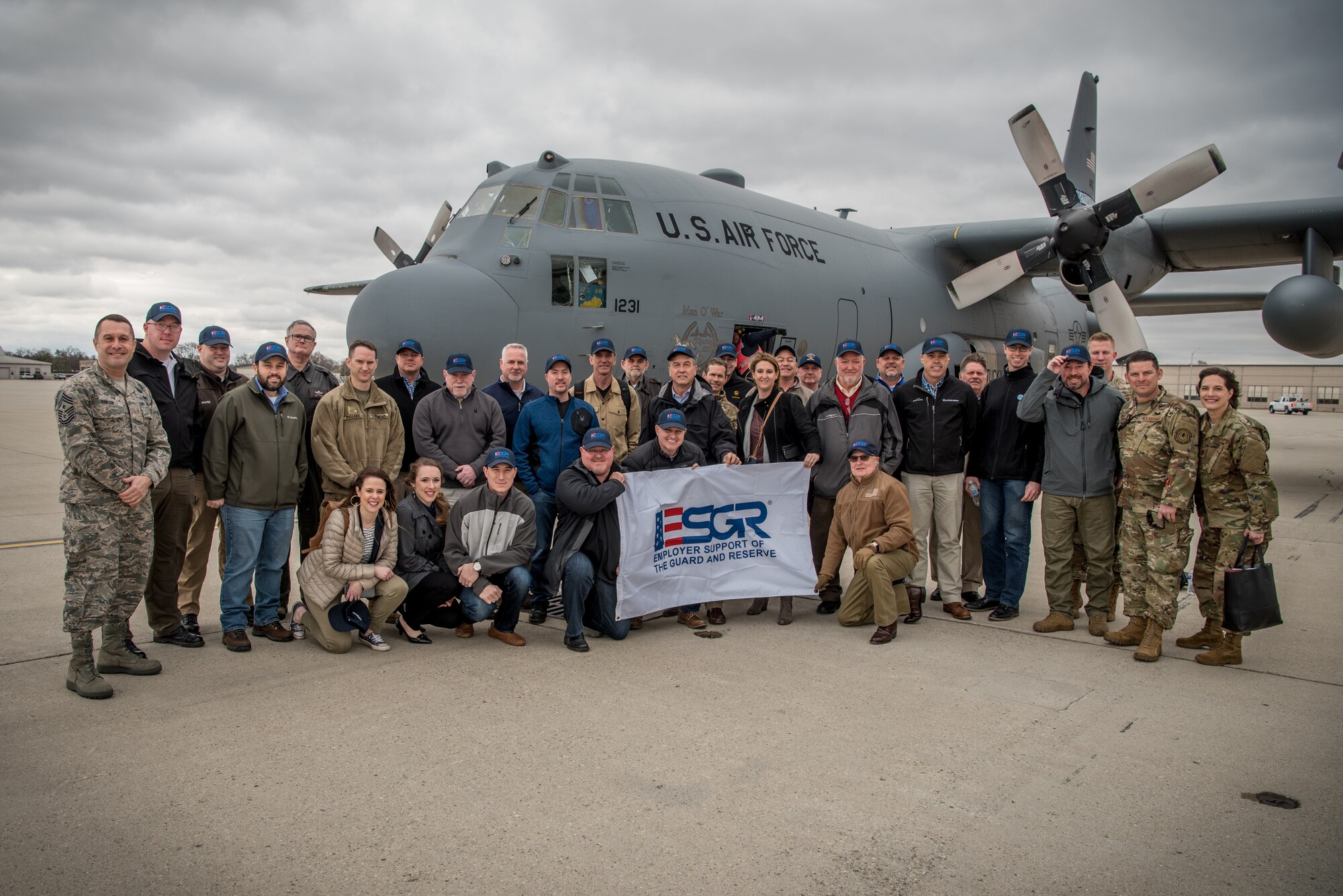 More than two-dozen civilian employers stand in front of a Kentucky Air National Guard C-130 Hercules aircraft at Wright-Patterson Air Force Base, Ohio, March 15, 2019, with Airmen from the 123rd Airlift Wing and representatives of the Kentucky Committee for Employer Support of the Guard and Reserve The employers were participating in an ESGR “Bosslift,” which enhances awareness and understanding between National Guardsmen and the civilian employers for whom they work when they’re not on duty. (U.S. Air National Guard photo by Staff Sgt. Joshua Horton)