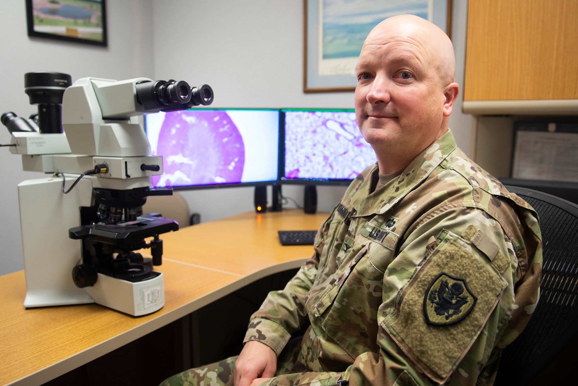 U.S. Army Col. Cary Honnold, Naval Medical Research Unit-Dayton comparative pathologist, poses in his NAMRU-D office on Wright-Patterson Air Force Base, Ohio, Jan. 17, 2019. Honnold crosses service lines by being an Army officer attached to a Navy unit on an Air Force base. (U.S. Air Force photo by R.J. Oriez)