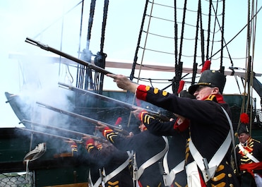 Boston, Mass. (June 23, 2006) - USS Constitution's 1812 Marine Guard fire vintage Springfield flintlock muskets during the shipÕs underway. 