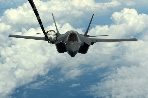 Caption: A U.S. Navy F-35C Lightning II is drogue refueled by a KC-10A during a training mission near Eglin Air Force Base, Florida, April 10, 2015. (U.S. Air Force photo by Staff Sgt. Brian Kelly)
