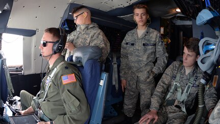 Civil Air Patrol cadets, Cadet Senior Airman Allen Doroshko, Cadet Airman Basic Caleb Wood, and Cadet Lt. Col. Jackson Baker, observe operations on the flight deck during an incentive flight over West Texas March 12. The cadets flew with the 433rd Airlift Wing at Joint Base San Antonio-Lackland.