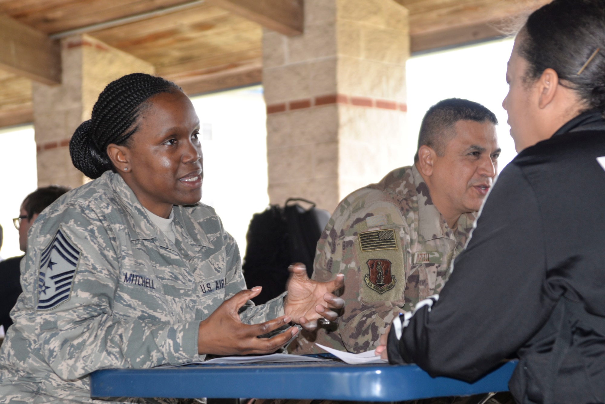 The Command Chief talks with Airmen and pre-basic training Airmen during a mentorship luncheon here March 24, 2019.