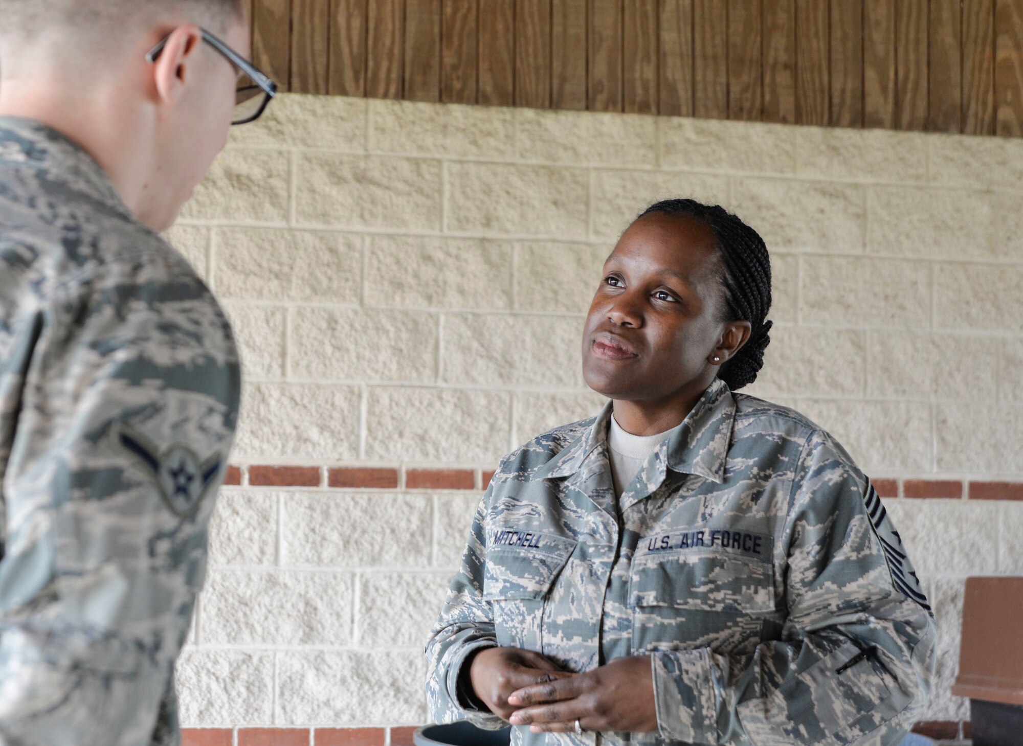 The Command Chief talks with Airmen and pre-basic training Airmen during a mentorship luncheon here March 24, 2019.
