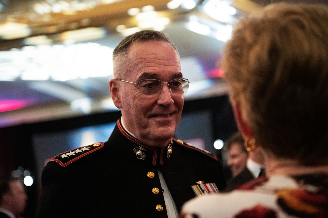 Marine Corps Gen. Joe Dunford, chairman of the Joint Chiefs of Staff, talks to his wife