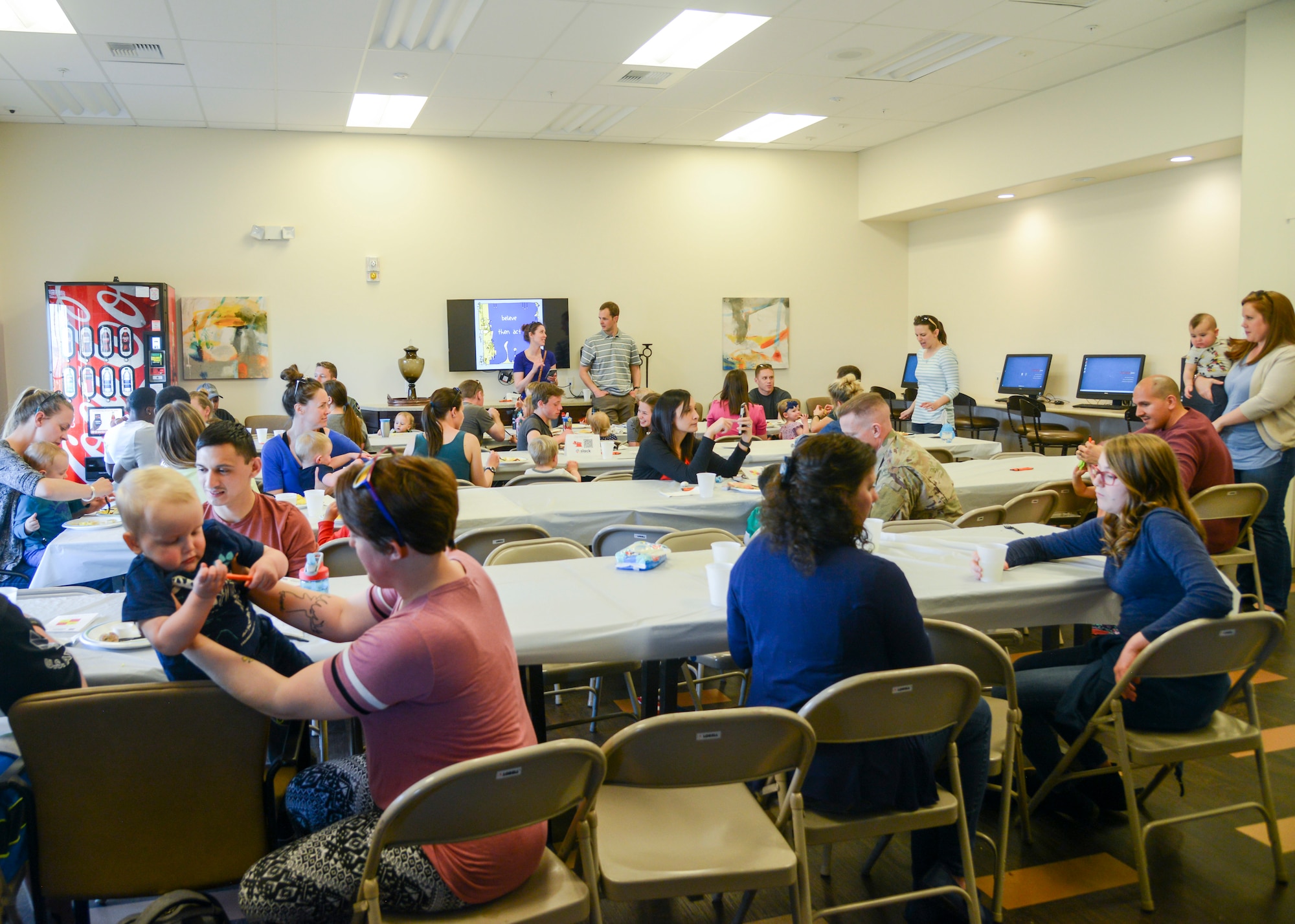 Airmen and their families eat pancakes, eggs and bacon and socialize during a Strong Family Program dinner event at the Mojave Sky Community Center at Edwards Air Force Base, California, March 18. (U.S. Air Force photo by Giancarlo Casem)