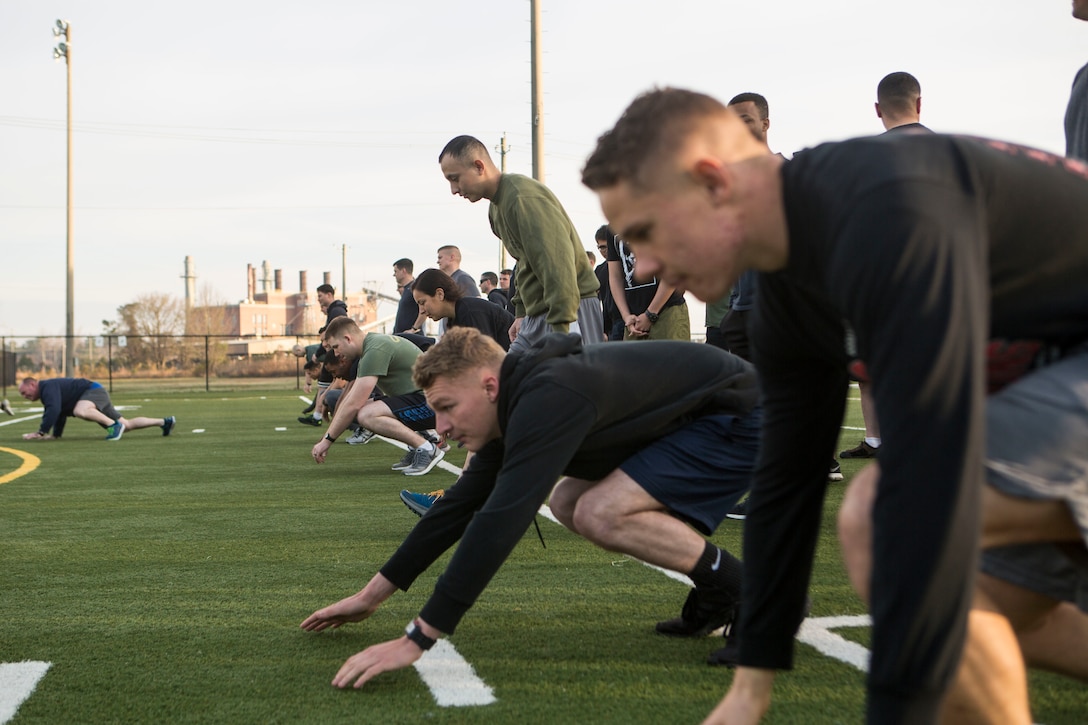 U.S. Marines and Sailors with 24th Marine Expeditionary Unit execute physical training at Camp Lejeune, N.C., Feb. 28, 2019. The training was held to promote unit cohesion and readiness. (U.S. Marine Corps photo by Lance Cpl. Larisa Chavez)