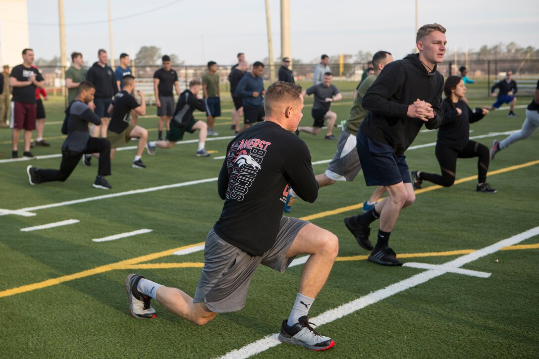 U.S. Marines and Sailors with 24th Marine Expeditionary Unit execute physical training at Camp Lejeune, N.C., Feb. 28, 2019. The training was held to promote unit cohesion and readiness. (U.S. Marine Corps photo by Lance Cpl. Camila Melendez)