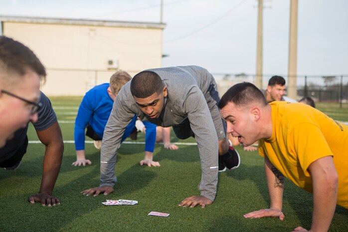 U.S. Marines and Sailors with 24th Marine Expeditionary Unit execute physical training at Camp Lejeune, N.C., Feb. 28, 2019. The training was held to promote unit cohesion and readiness. (U.S. Marine Corps photo by Lance Cpl. Camila Melendez)