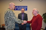 Distribution’s Estes presented commander’s coin