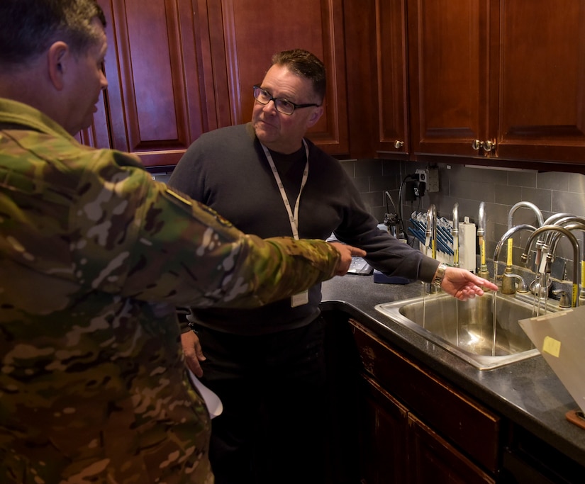 Robert Lauer, Pride Industries Water Treatment Plant assistant manager, shows the water plants in-house testing laboratory to U.S. Air Force Col. Neil R. Richardson, Joint Base McGuire-Dix-Lakehurst and 87th Air Base Wing commander, during a Water Production Plant tour March 26, 2019 at Joint Base MDL, New Jersey. Finished water is sampled in this area. (U.S. Air Force photo by Airman 1st Class Briana Cespedes)