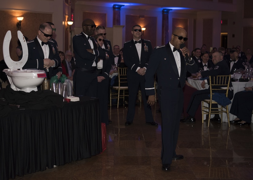 U.S. Air Force Col. Dalian Washington, 87th Mission Support Group commander, performs a skit with other members of the 87th MSG during the 87th Air Base Wing’s Dining Out celebration at The Merion event center in Cinnaminson, N.J., March 22, 2019.  The night was filled with recognition for community and mission partners across the installation for the years of teamwork which reflected the 87th ABW motto of Ut Unum Vincere “Win as One.” (U.S. Air Force photo by Airman 1st Class Ariel Owings)