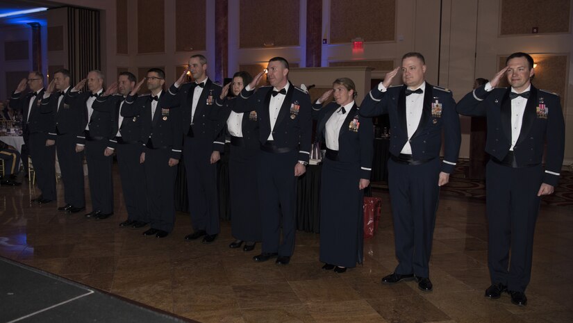 Wing commanders from Joint Base McGuire-Dix-Lakehurst Air Force units salute the 87th Air Base Wing commander during the 87th ABW Dining Out celebration at The Merion event center in Cinnaminson, N.J., March 22, 2019. The ballroom was filled with service members of various ranks celebrating the accomplishments that have been made within the wing in the last ten years. (U.S. Air Force photo by Airman 1st Class Ariel Owings)