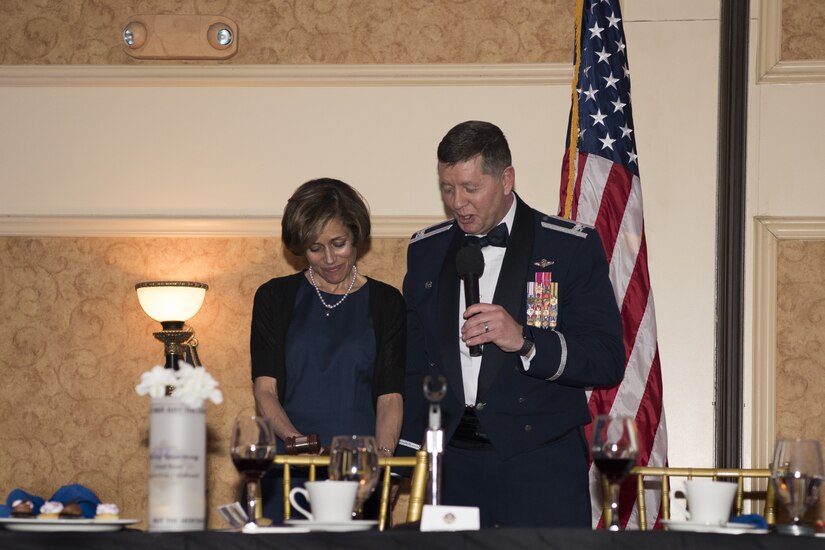 U.S. Air Force Col. Neil R. Richardson, Joint Base McGuire-Dix-Lakehurst and 87th Air Base Wing commander, presents an award to U.S. Air Force retired Lt. Gen. Gina Grosso during the 87th ABW Out celebration at The Merion event center in Cinnaminson, N.J., March 22, 2019. Grosso became the first commander of Joint Base MDL in 2009 as a colonel. Due to the inactivation of the 87th Troop Carrier Wing in 1952, Grosso was given the responsibility of rebuilding the wing into what is now – the 87th ABW. (U.S. Air Force photo by Airman 1st Class Ariel Owings)