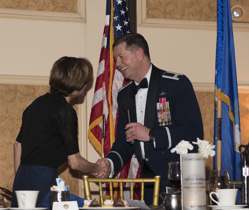 U.S. Air Force Col. Neil R. Richardson, Joint Base McGuire-Dix-Lakehurst and 87th Air Base Wing commander, shakes U.S. Air Force retired Lt. Gen. Gina Grosso’s hand during the 87th ABW Dining Out celebration at The Merion event center in Cinnaminson, N.J., March 22, 2019. Grosso spoke of the impressiveness from members of the ten-year-old wing earning six Air Force Outstanding Unit Awards while some older units have never once received the award and challenged the residing Airmen to build on the success in future endeavors. (U.S. Air Force photo by Airman 1st Class Ariel Owings)