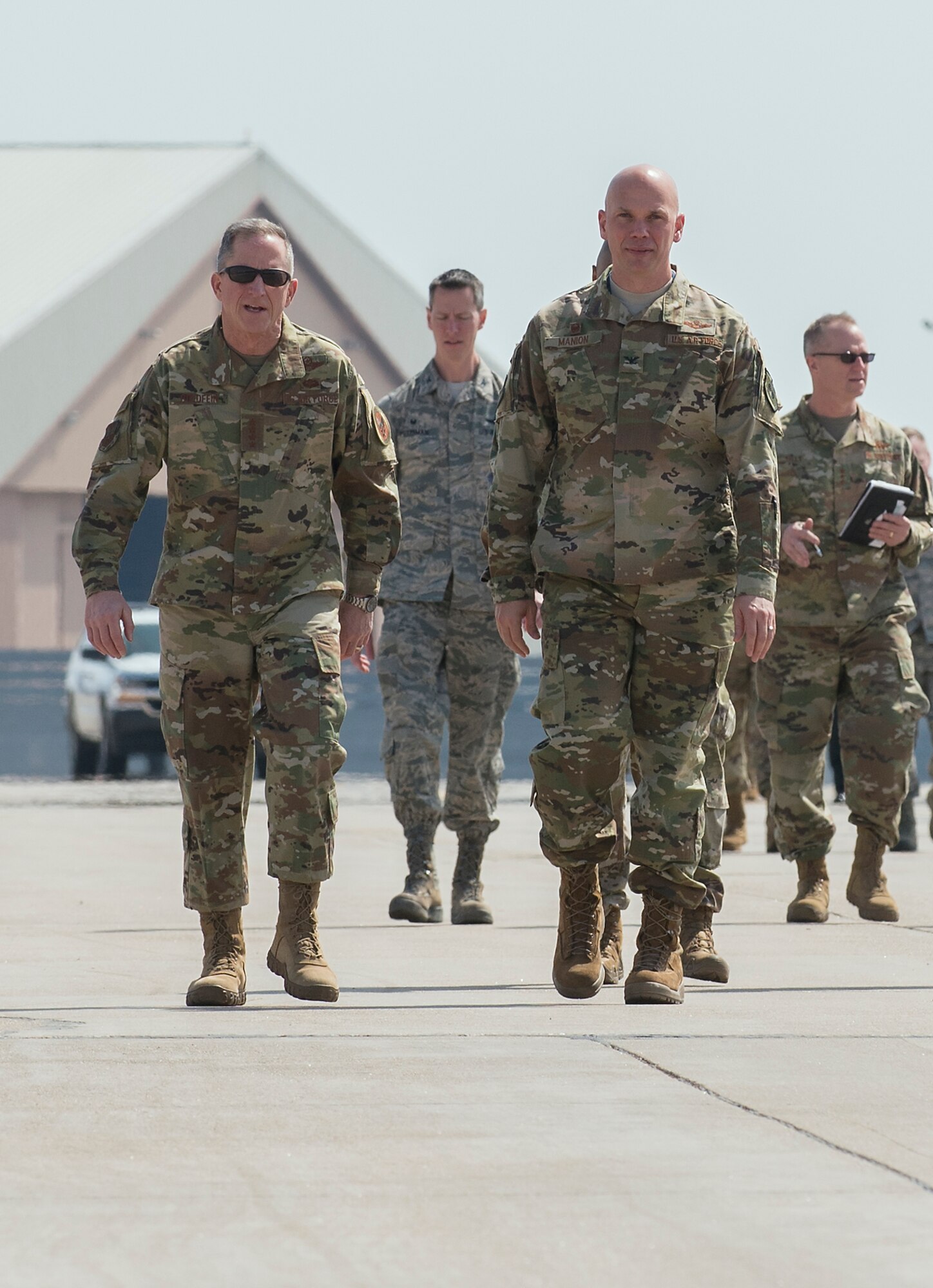 Air Force Chief of Staff Gen. David L. Goldfein, center left, talks with Col. Michael Manion, 55th Wing commander, while visiting Offutt Air Force Base, Nebraska, March 27, 2019, to survey damage caused by recent flooding and to meet with Team Offutt Airmen. A record-setting snowfall over the winter, in addition to a large drop in air pressure, caused widespread flooding of nearby rivers and waterways. (U.S. Air Force photo by Delanie Stafford)