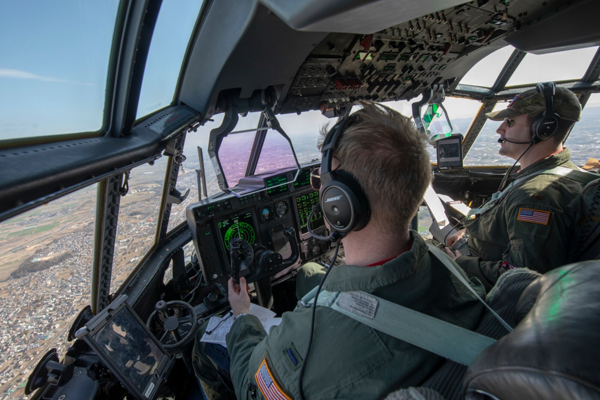 (Left to right) 1st Lt. Matthew Crader and Maj. Daniel Gnazzo, both with the 36th Airlift Squadron C-130J pilots