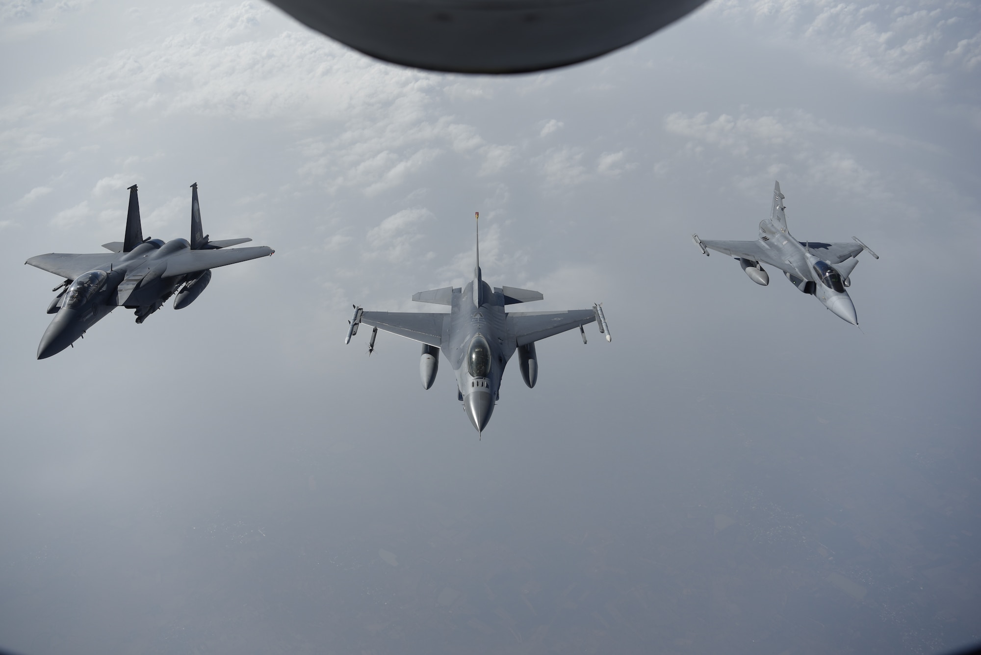 A U.S. Air Force F-16C Fighting Falcon leads a multi-nation dissimilar aircraft formation alongside a Republic of Singapore air force F-15SG and a Royal Thai air force JAS-39 Gripen during COPE Tiger 2019 at Korat Royal Thai Air Force Base, Thailand, March 21, 2019. COPE Tiger is an annual multilateral aerial exercise aimed at improving combat readiness and interoperability between the Republic of Singapore air force, Royal Thai air force, and U.S. Air Force, while concurrently enhancing the three nations' military relations. (Photo courtesy of MINDEF SINGAPORE)