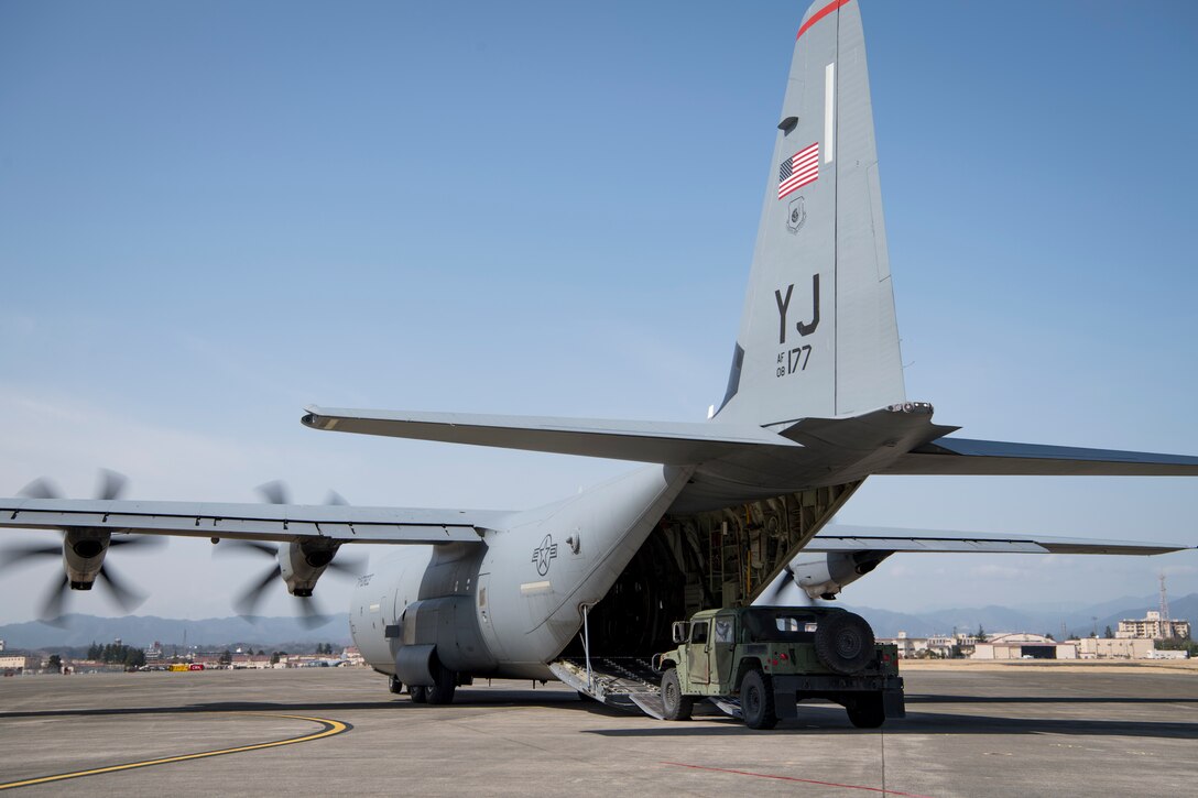 Aircrew with the 36th Airlift Squadron load a Humvee onto a C-130J Super Hercules during the Yokota C-130J Rodeo March 22, 2019, at Yokota Air Base, Japan. The competition demonstrated various combat capabilities and standards of the C-130 aircrews. (U.S. Air Force photo by Senior Airman Donald Hudson)