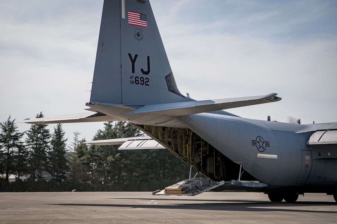 A 36th Airlift Squadron C-130J Super Hercules aircrew perform a combat offload of a training pallet during the Yokota C-130J Rodeo March 22, 2019, at Yokota Air Base, Japan. The competition consisted of six events in execution and precision of various aircraft loading, offloading, and flying operations. (U.S. Air Force photo by Senior Airman Donald Hudson)